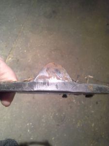 The clip, viewed from the side of the shoe.